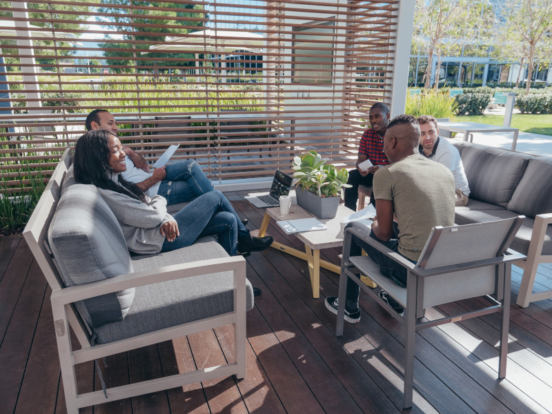 Team gathered outdoors working